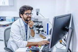 Doctor looking at a copmuter screen